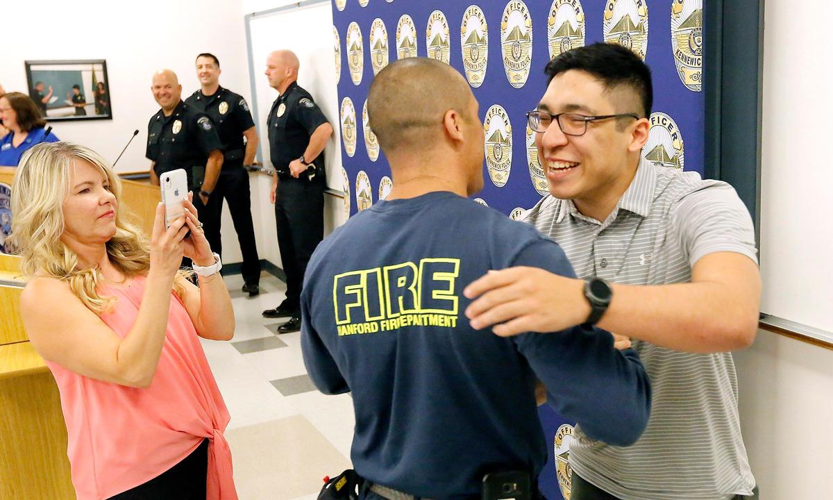 Lori Lovato videos Anthony Lovato III, right, being hugged by his father, Anthony, following Monday’s award presentation at the Kennewick Police Department Watch a video at: tricityherald.com/video
