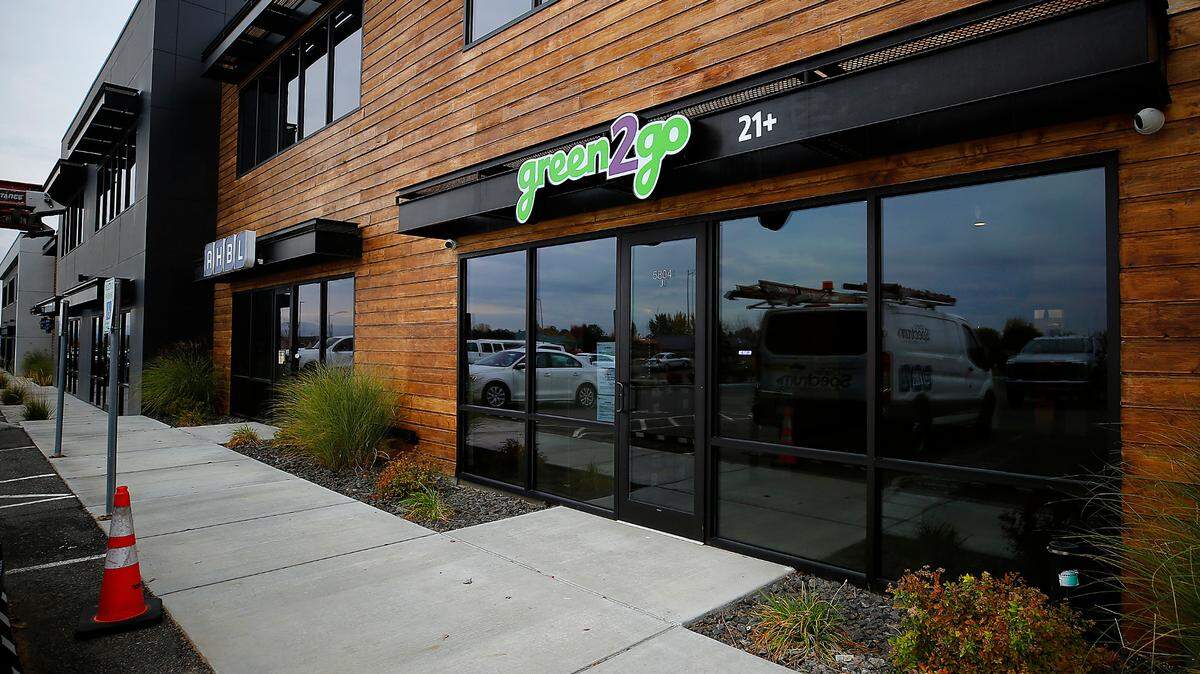 The new Green2Go cannabis store opened on Road 90 in west Pasco last year. Thieves drove a Kia Soul through the glass front of the store.