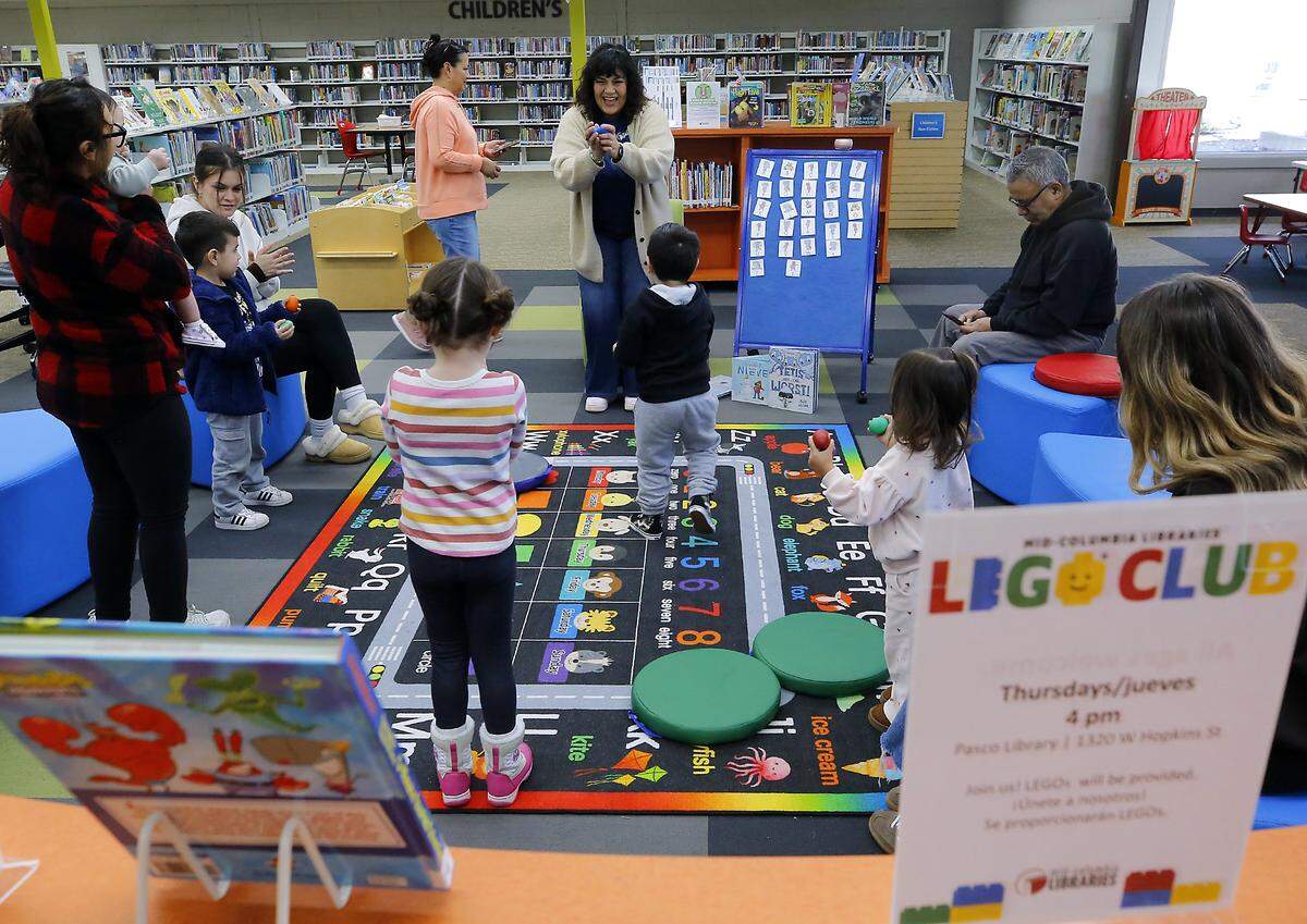 Customer service specialist Alpha Gonzalez conducts a bilingual story time session at The Mid-Columbia Libraries' Pasco Branch, which is the second largest branch of the library system's 12 branches.