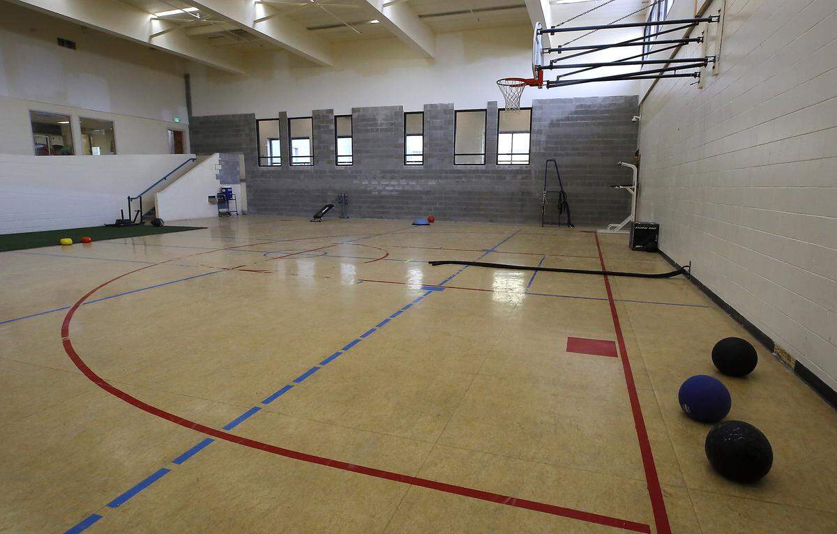A new, yet to be painted, concrete block wall is visible in the gymnasium at the Benton County Juvenile Justice Center.