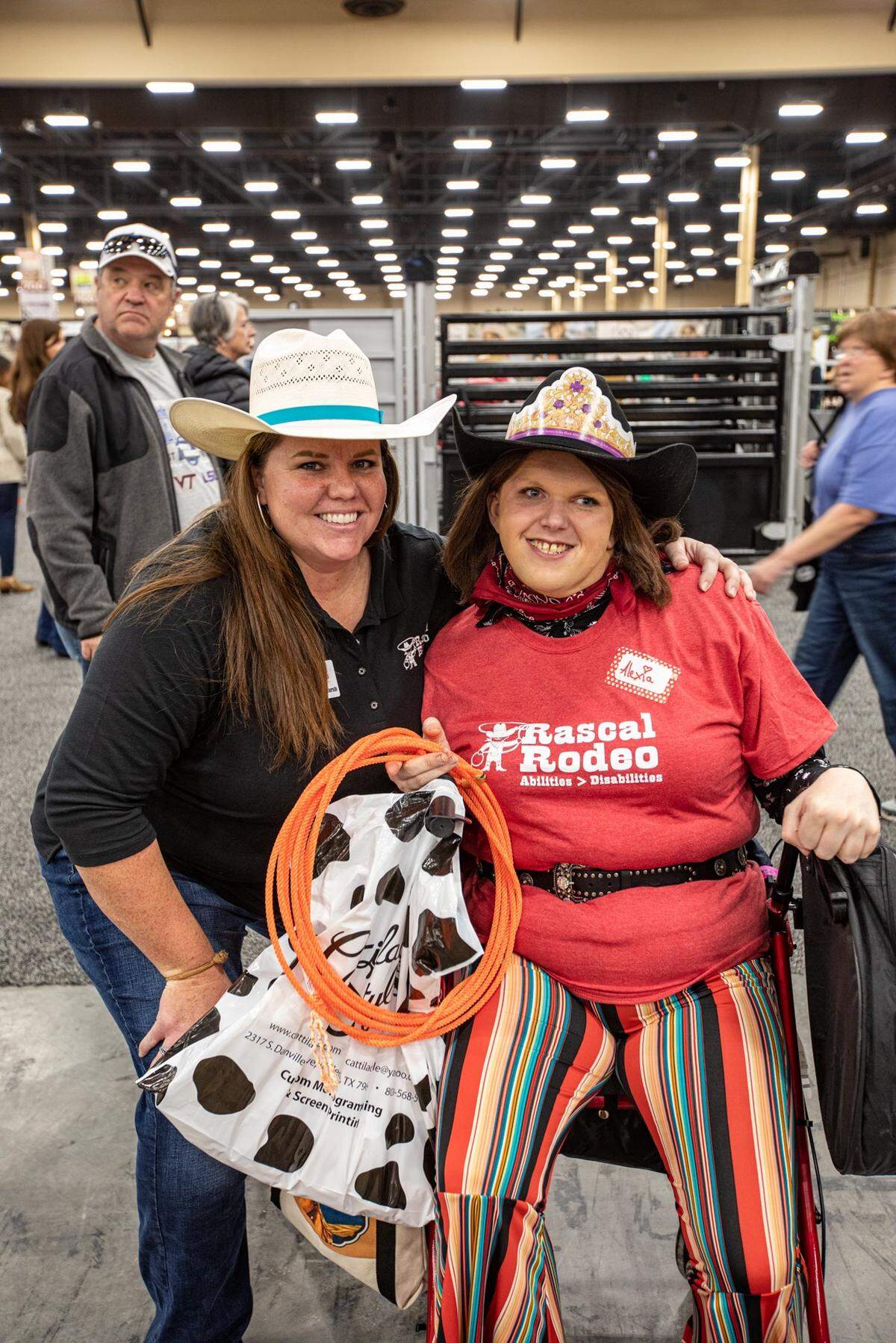 Rascal Rodeo founder Ann-Erica Whitemarsh shares a moment with Alexia Adamson of Liverpool, England, at the 2019 Wrangler National Finals Rodeo in Las Vegas.