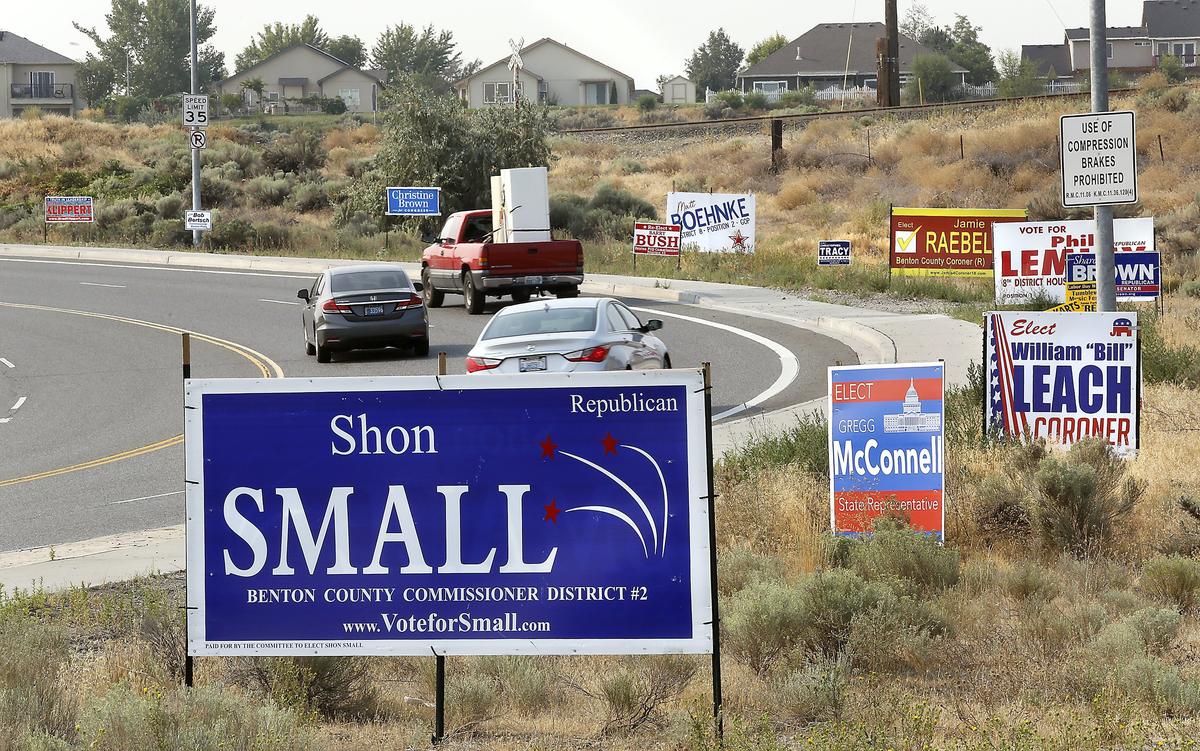 Motorists drive past numerous candidate election signs on Steptoe posted near the roundabout on North Steptoe Street for the state’s recent primary election.