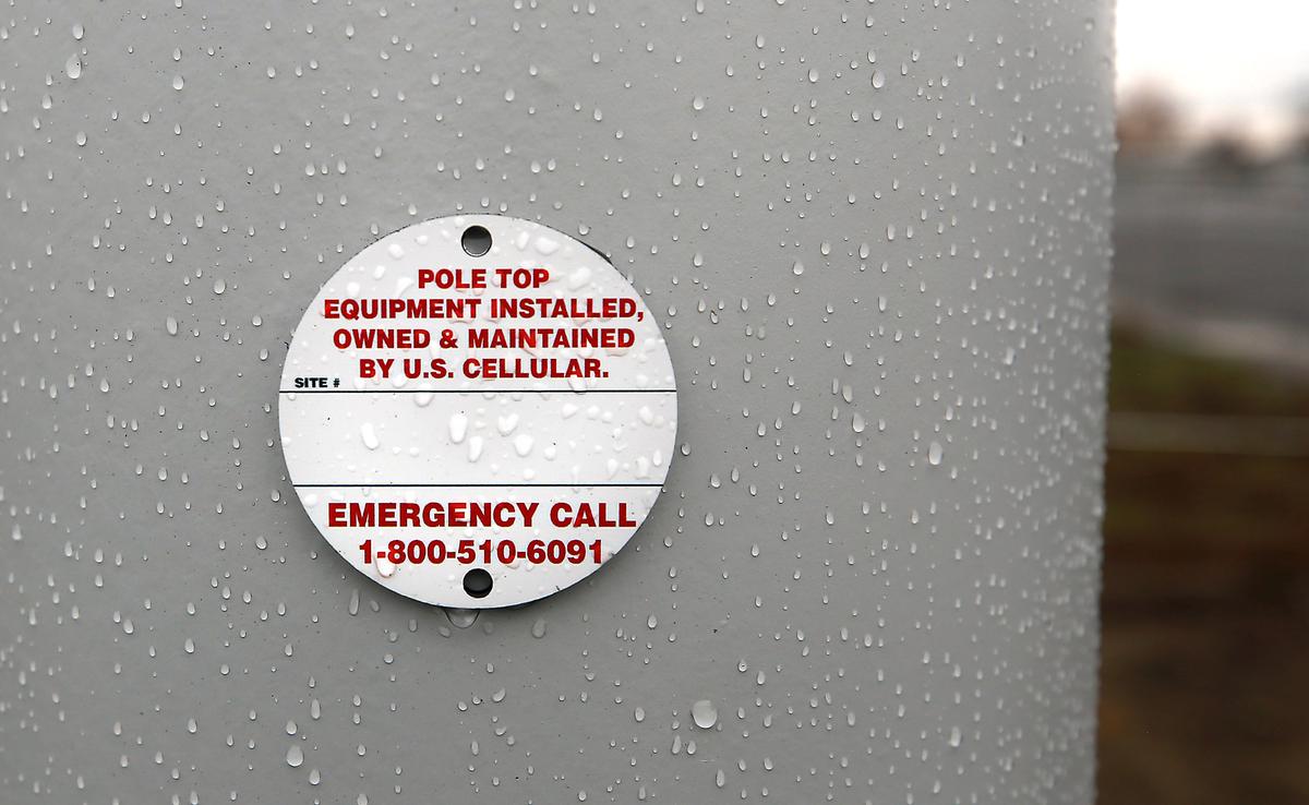 Identification tag on a new style cell phone tower incorporating a street light that was installed by U. S. Cellular near the corner of West 10th Avenue and South Auburn Street in Kennewick.