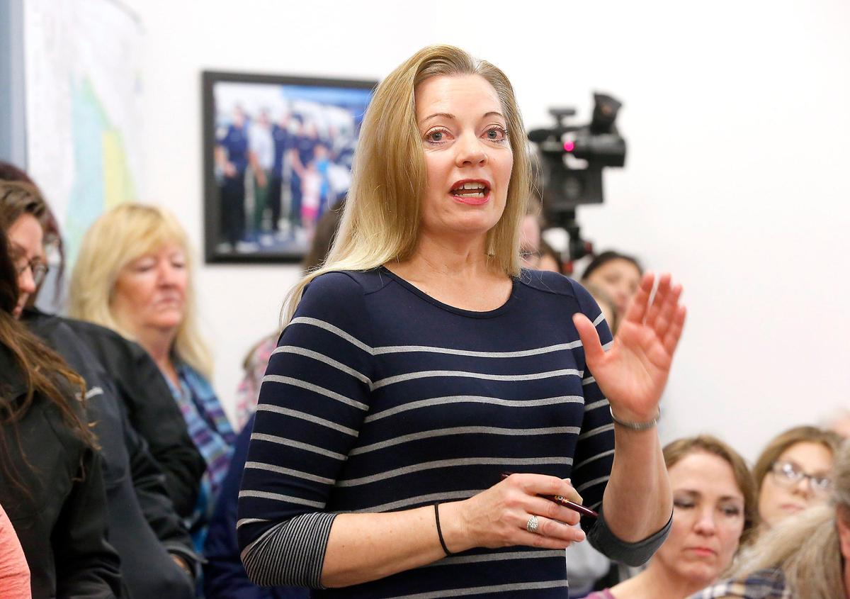 Business owner Wendy Robbins questions Dr. Jeff Allgaier of Ideal Option about the lack of notification and choice of location for a new needle exchange program in a building he just bought in the Vista Way area of Kennewick.