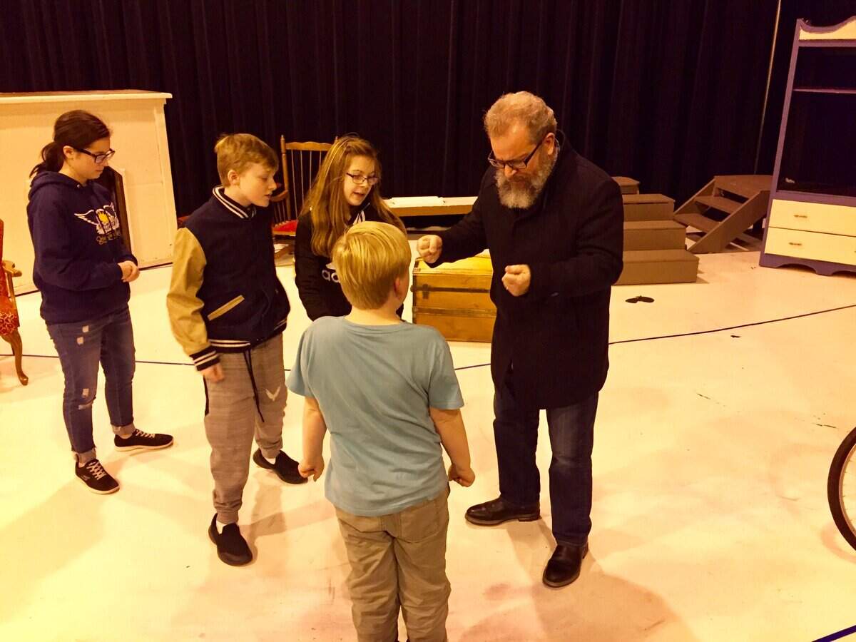 Reginald Unterseher, of Mid-Columbia Mastersingers, works with young performers in 2018. He’s currently waiting for results of a COVID-19 test.