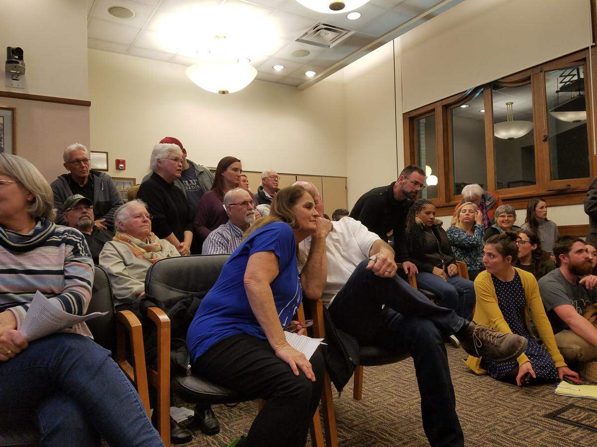 A crowd of people were forced to stand in the planning commission hearing room as they waited to talk about a Mirror Ministries project.