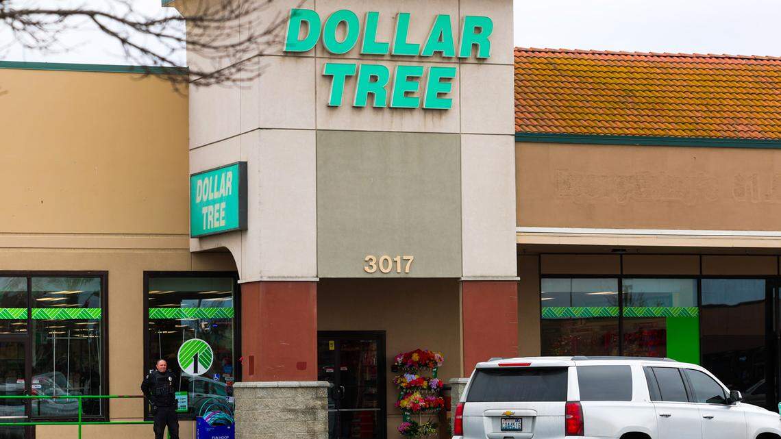 A security guard stands outside the Dollar Tree store on Kennewick Avenue in February 2026 after a 26-year-old man was fatally stabbed in the store's parking lot.
