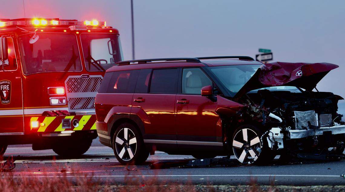 Washington State Patrol troopers investigate a two-vehicle crash near Highway 395 and East Vineyard Road early Tuesday. 