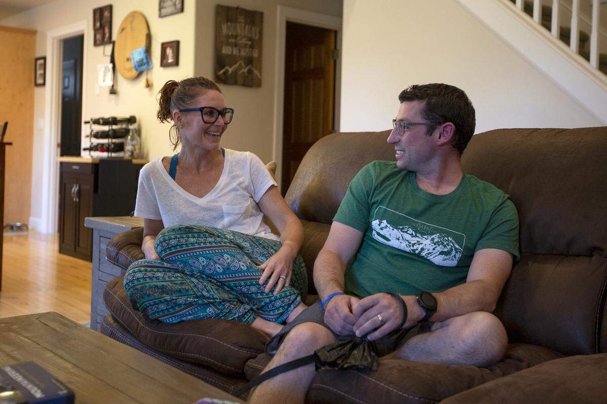 CJ Shane laughs while looking at her husband as she recounts how cold it was on Mt. Rainier when they made it to the top.