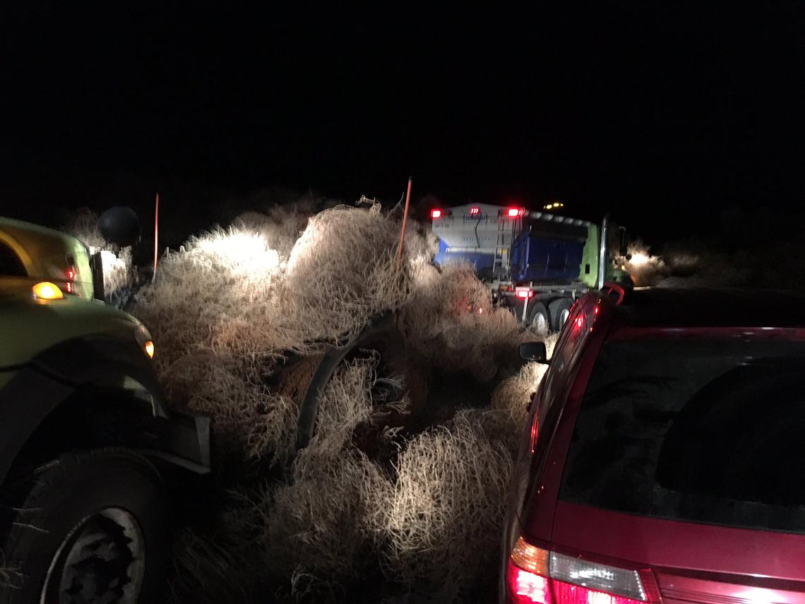 Blowing tumbleweeds on Highway 240 had to be cleared from the closed roadway with plow trucks.