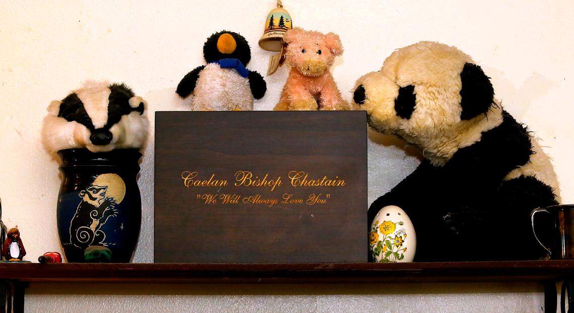 Jim Chastain and his wife, Miriam, keep the cremation box for their 17-year-oldson, Caelan Chastain, a Hanford High School junior who died by suicide in February 2021, in the living room of their Richland home. They are fighting for an “empty seat” at th son’s graduation ceremony in hopes that his life is remembered.