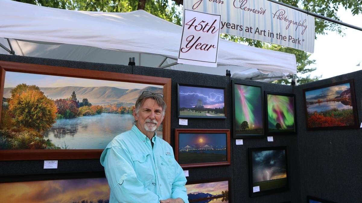 John Clement stands at his booth at Art in the Park in Richland.