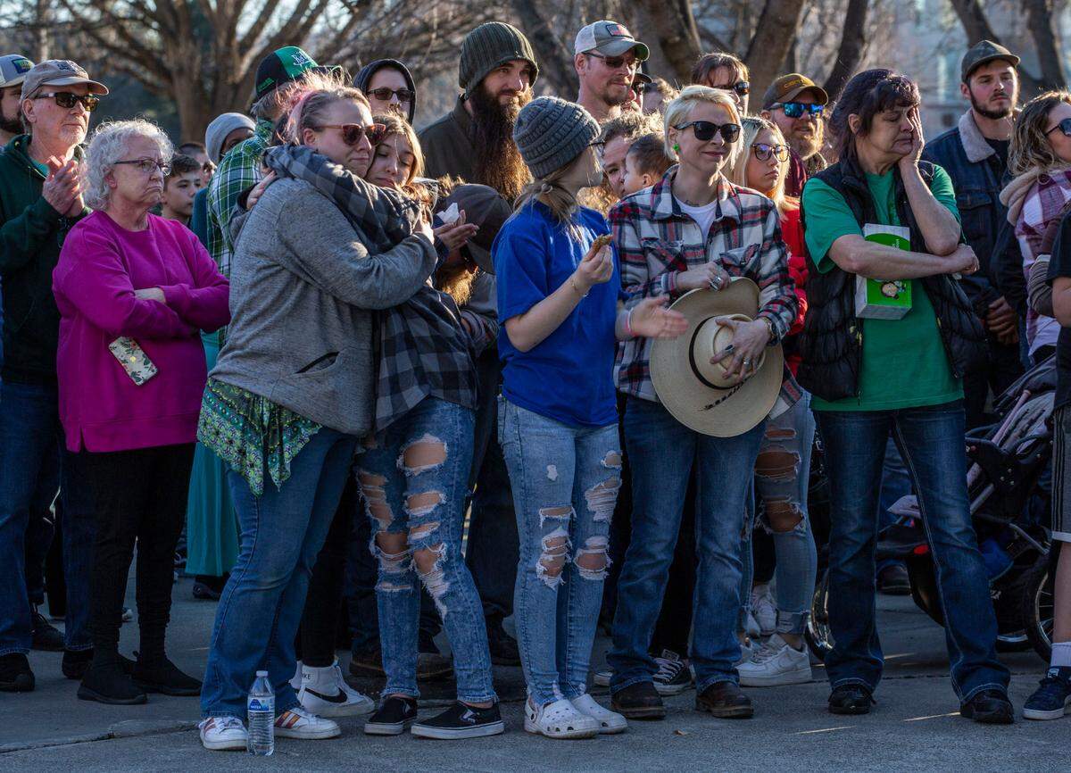 About 300 people gathered in Howard Amon Park on Thursday afternoon to share memories of Justin Krumbah, the Instacart worker who was shot Monday morning inside Fred Meyer in Richland.