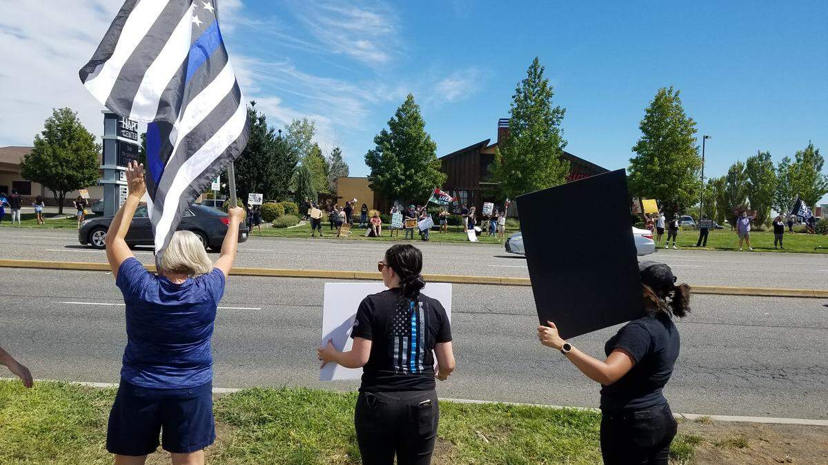 About 50 people rallied in support of Tri-Cities police departments on Saturday along Road 68 in Pasco. And some 75 Black Lives Matter supporters stood across the busy street taking their own stand against systemic injustice.