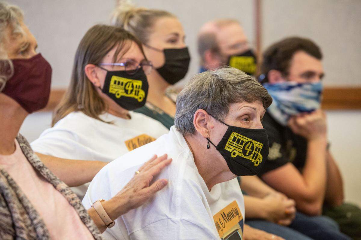 Pasco school bus driver Richard Lenhart’s widow, Nancy, is comforted during a 2021 hearing for Joshua Davis who is charged in the fatal stabbing.