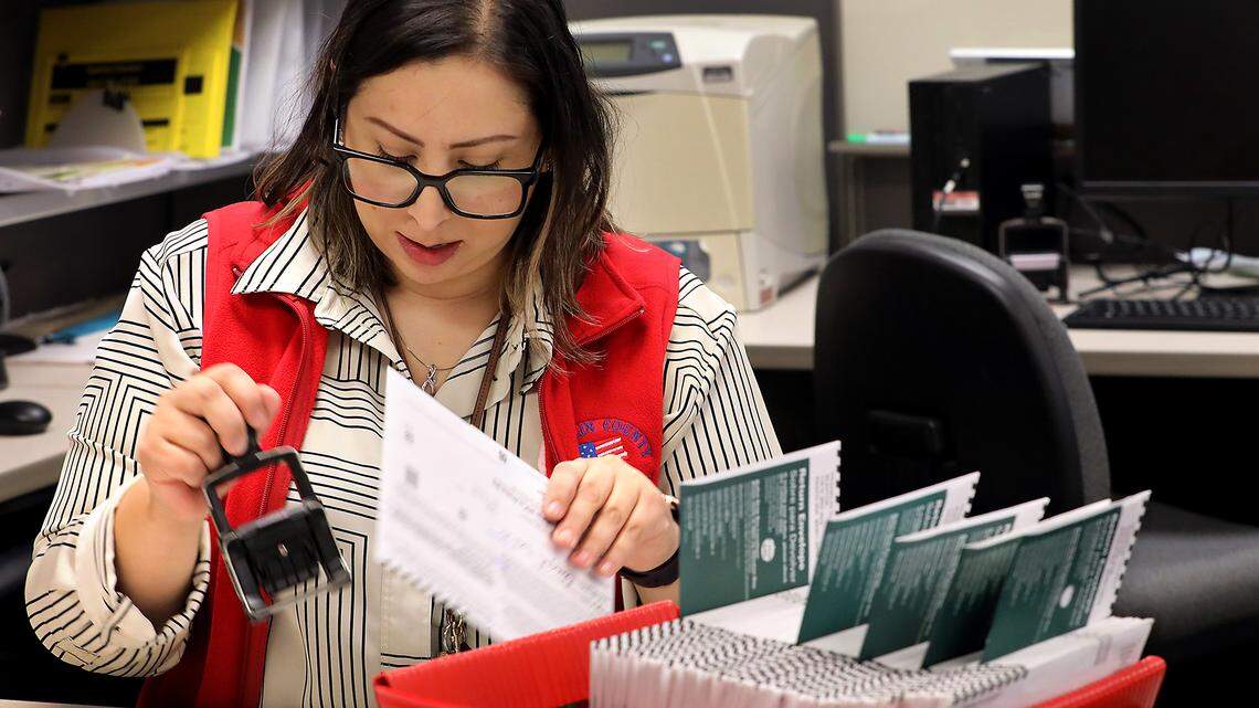Elections assistant Aracely Medina count and batch ballots from the drop box at the Franklin County Courthouse Tuesday morning at the Franklin County Elections Center facility.