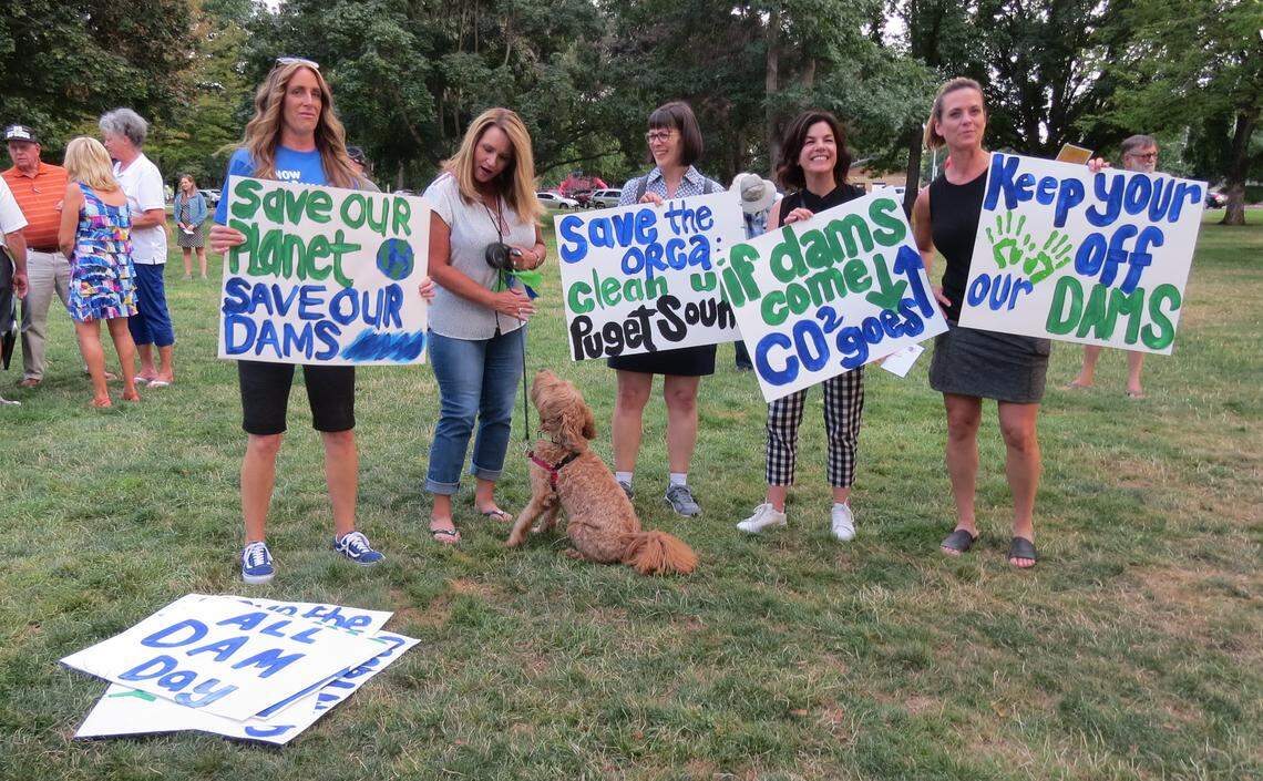 More than 100 people, and a few dogs, rallied Monday night at Howard Amon Park in Richland in opposition to breaching the four lower Snake River dams in Eastern Washington.