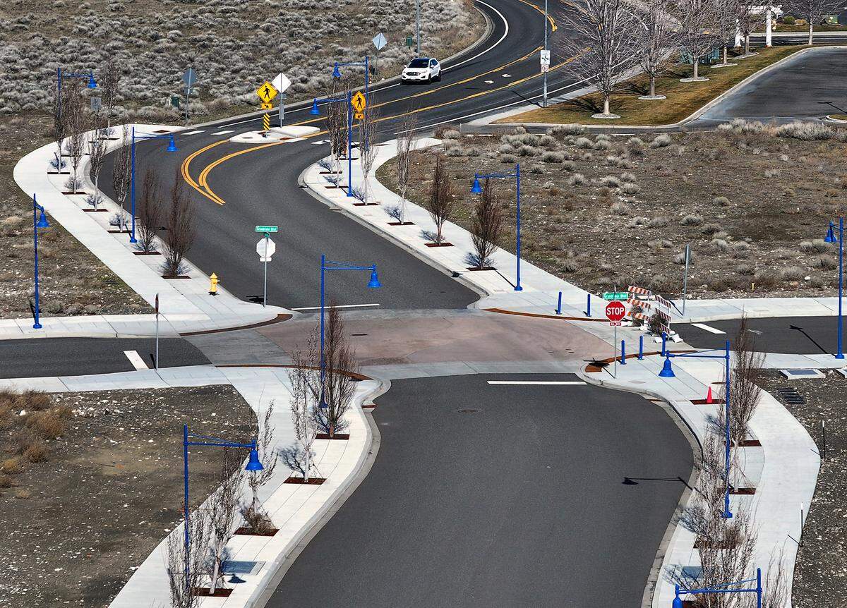 Car drives south on Crosswind Boulevard in Vista Field in west Kennewick. Taken Feb. 26, 2025