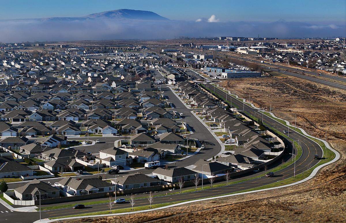 Housing development off Chapel Hill Boulevard in west Pasco with Rattlesnake Mountain in the background. 