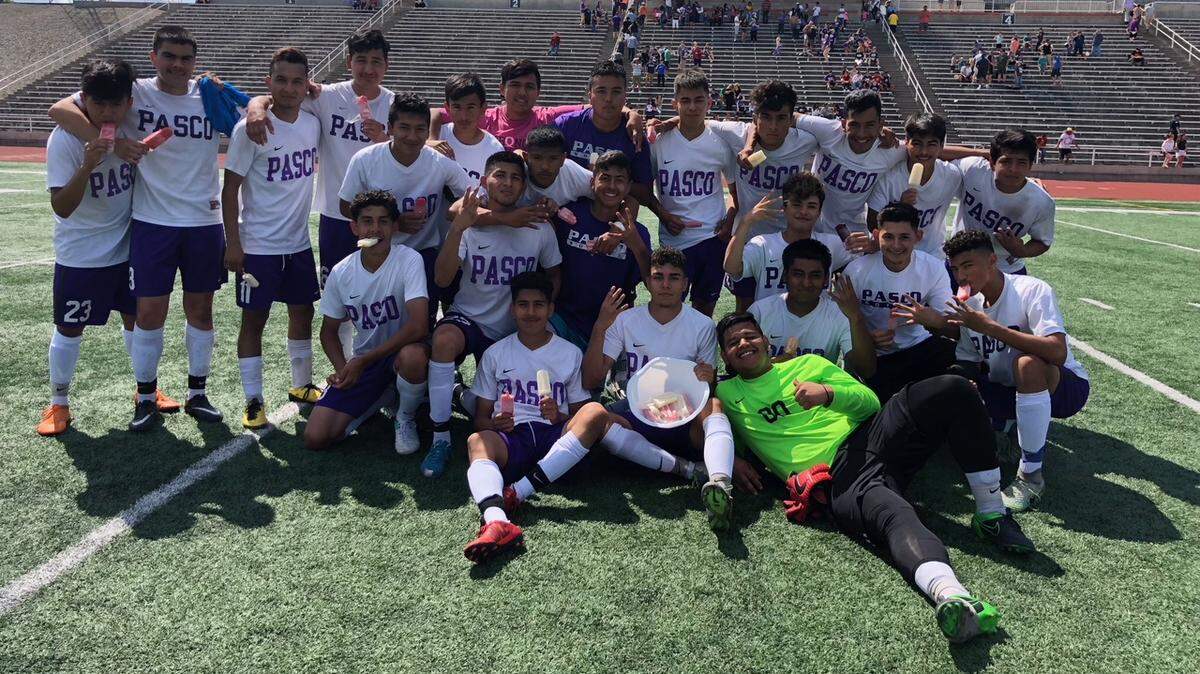 The Pasco boys soccer team celebrates its 2-1 win over Lewis and Clark in the state quarterfinals May 19 at Edgar Brown Stadium in Pasco. The Bulldogs will play Eastmont in the semifinals Friday in Puyallup.
