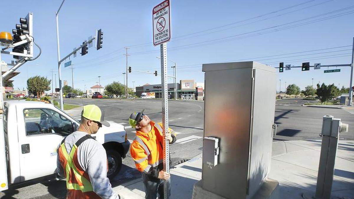 Kennewick employees installed new panhandling signs to encouraging motorists to contribute to local charities instead of handing out cash and other items directly to individuals.