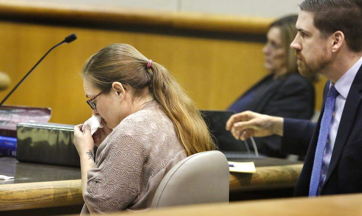 Prosser mother Amy S. Brown wipes away tears as she watches her emotional interview recorded by Benton County Sheriff’s investigators and played at her murder trial in Benton County Superior Court. She is accused of killing her friend Amanda Hill during party in Prosser in 2018. Brown’s attorney is Adam Pechtel. Watch a video at: tricityherald.com/video
