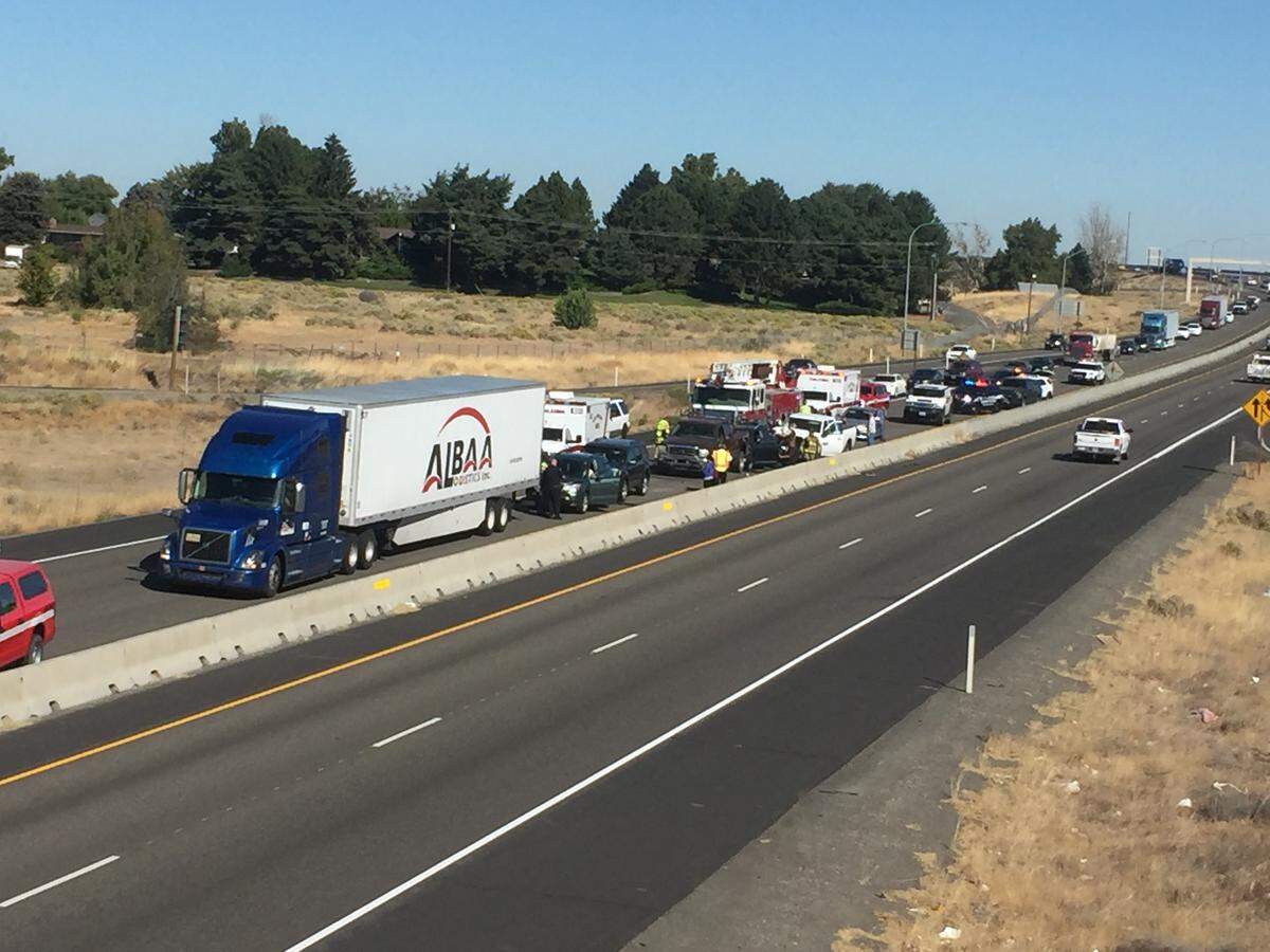 Police respond to a multi-car crash on southbound Highway 395 in Pasco. The crash happened as drivers already were slowed down because of work on the blue bridge.