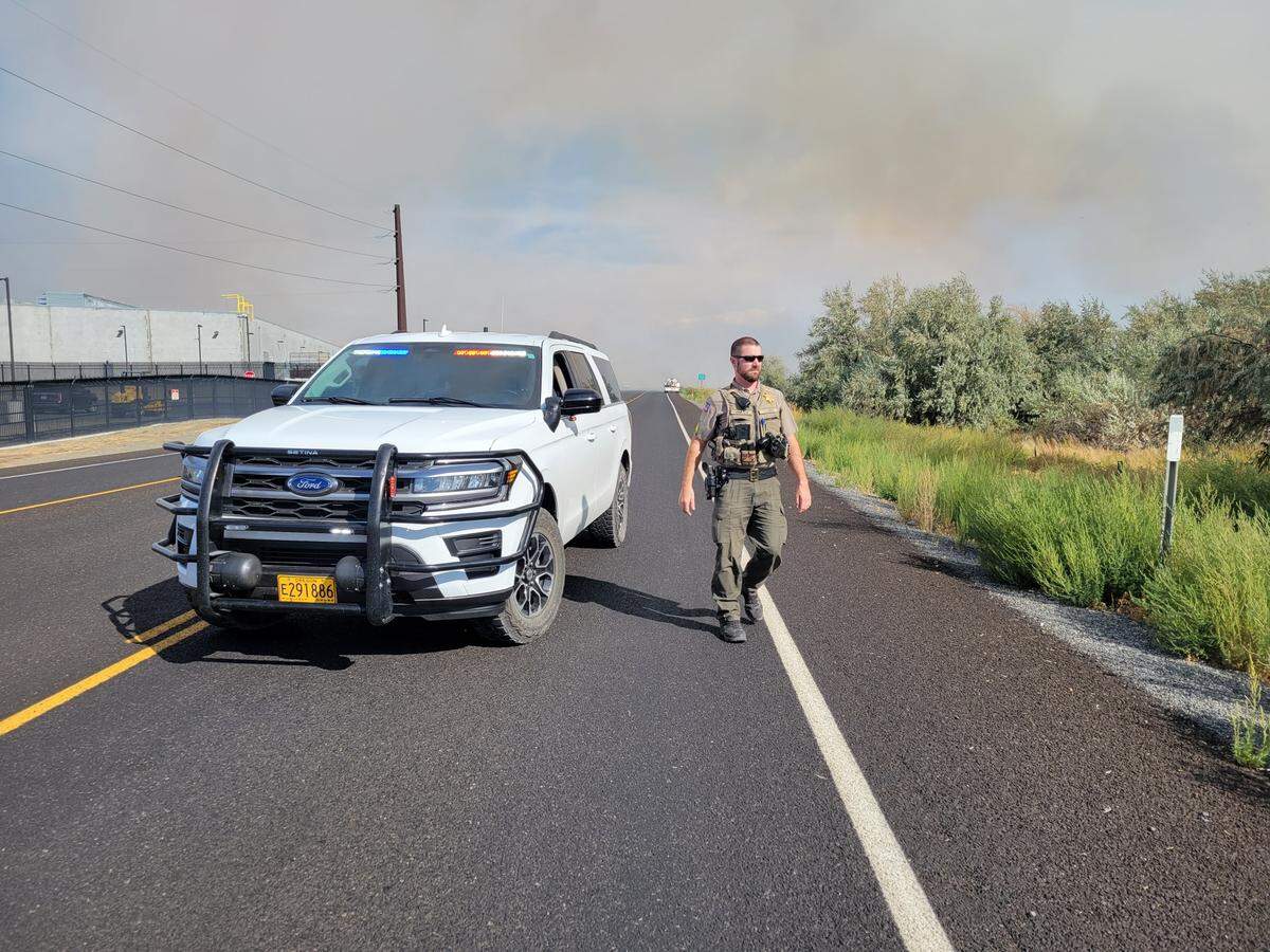 Sgt. Cody Marcum with the Umatilla County Sheriff’s Office helps with evacuation notices near McNary Dam in Oregon.