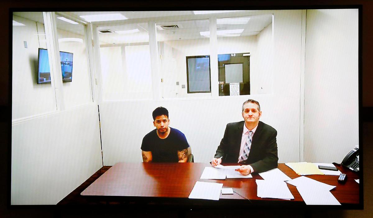 Suspected fatal hit-and-run driver Eduardo Lopez, left, makes a preliminary appearance in Franklin County Superior Court via a video link with provisional defense attorney Michael Quillen on Monday in Pasco.