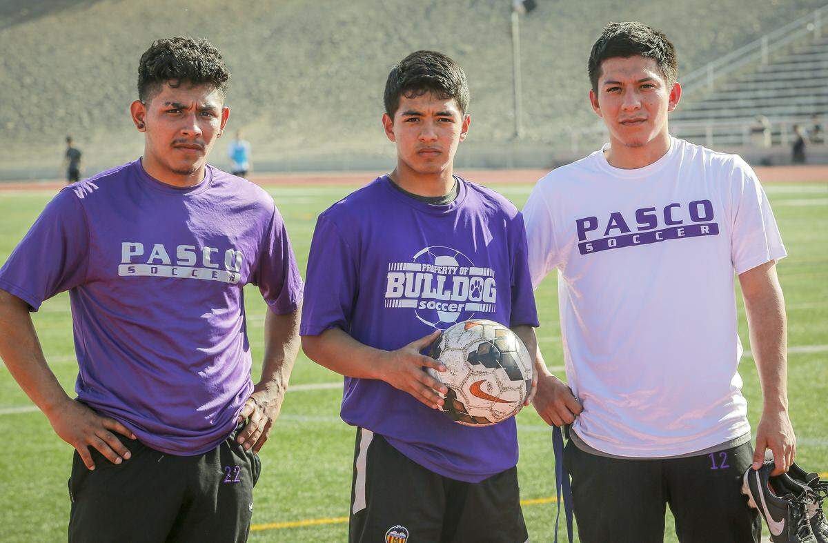 Pasco sibling’s Jesus, Kevin and Emilio Meraz-Rodriguez stand on a soccer field at Edgar Brown Memorial.  The brothers all went to Pasco High School and are gifted soccer players. 