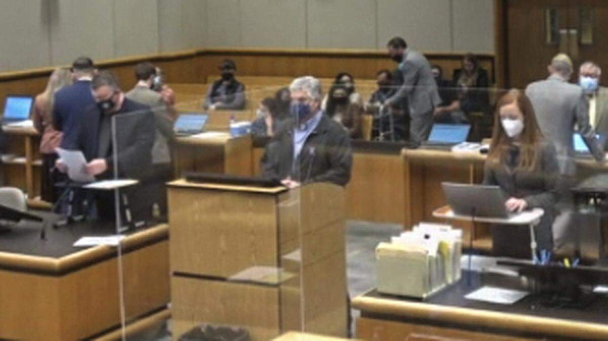 John M. Bittinger, a longtime science teacher at Richland High, stands behind the center podium Wednesday in Benton County Superior Court for charges of third-degree child molestation.