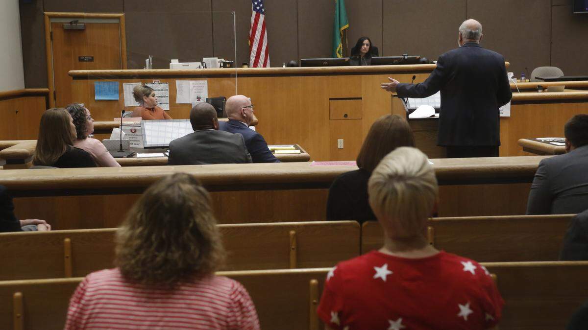 Richland school board members Kari Williams, Audra Byrd, Semi Bird, at left, sit with their attorney Jerry Moberg as Benton County Superior Court Judge Norma Rodriguez listens to attorney Doug McKinley make his arguments Monday about the recall petition.