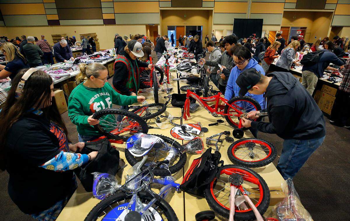 A teacher and students from the Columbia Burbank FFA program volunteer during Thursday’s 2024 Bikes for Tikes build day event. More than 600 community volunteers participated in the annual event to build more than 1,600 bicycles for distribution during Christmas around the Mid-Columbia region.