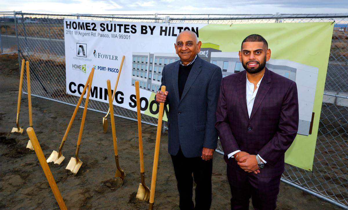 A-1 Hospitality, led by president Vijay Patel ,left, and son, Taran Patel, managing principal, broke ground for a new hotel, Home2 Suites by Hilton, on West Argent Road, between its existing Courtyard by Marriott and a Circle K to the west.