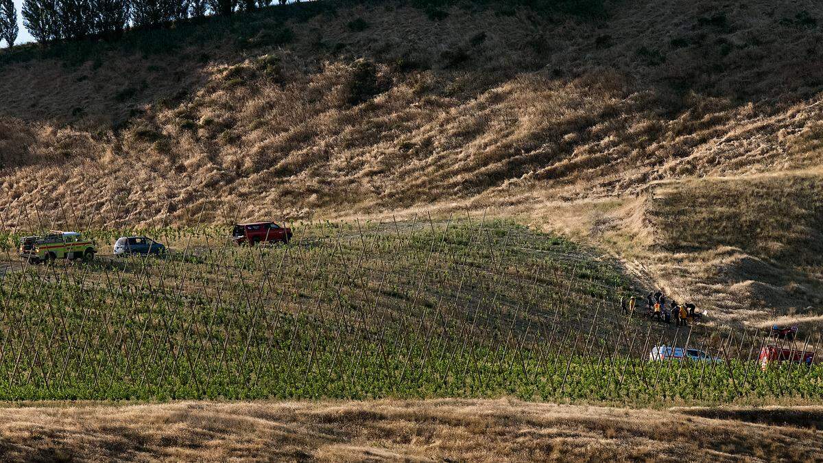 First responders treat a critically injured woman ATV driver in a rural Franklin County orchard before she was taken to a hospital by a Life Flight helicopter.