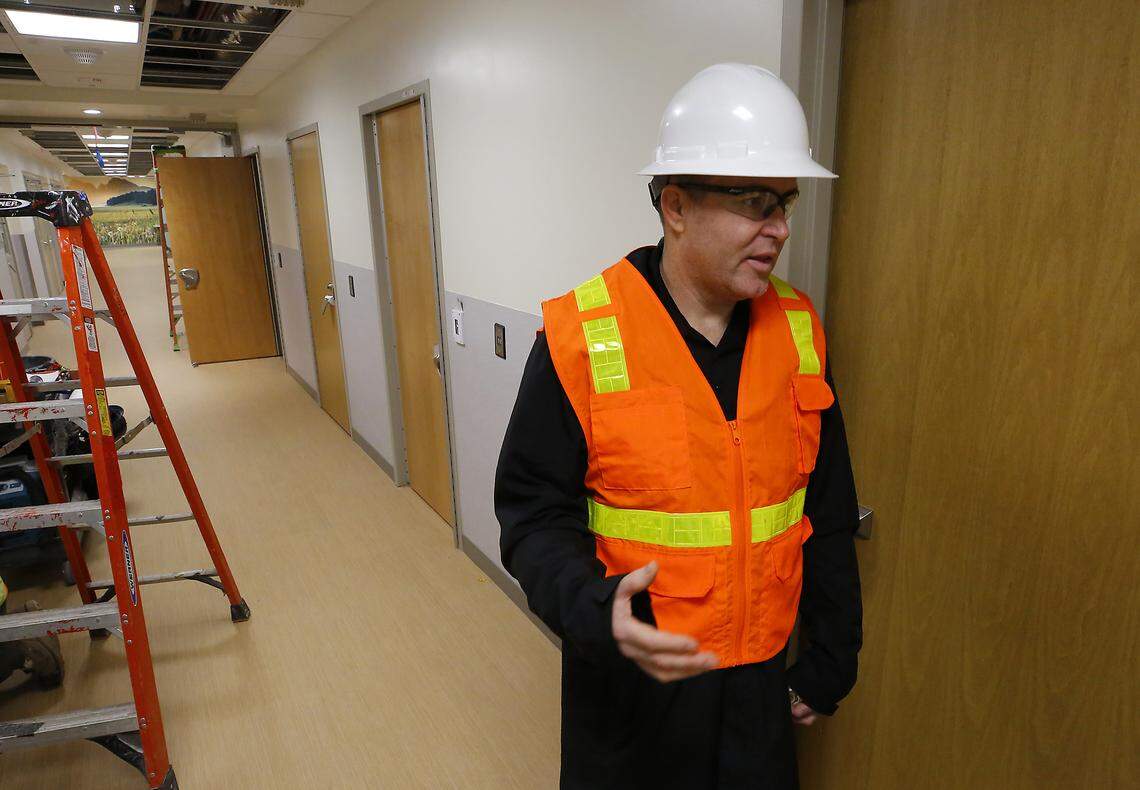 Matt Rasmussen, Benton County deputy administrator, stands in a hallway of the crisis stabilization unit discussing the construction progress on the Columbia Valley Recovery Center in downtown Kennewick.