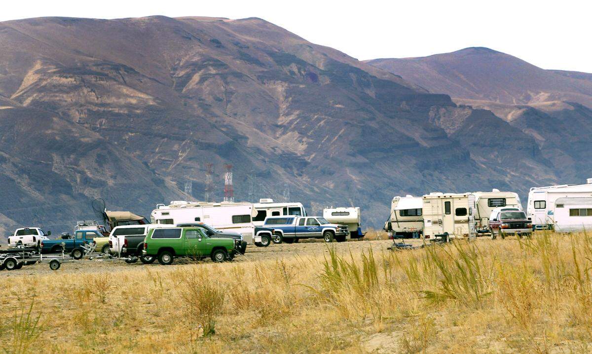 A makeshift gathering of trucks, campers and motor homes fill the parking area near the boat launch upriver of the Vernita Bridge on the Columbia River in Grant County. 