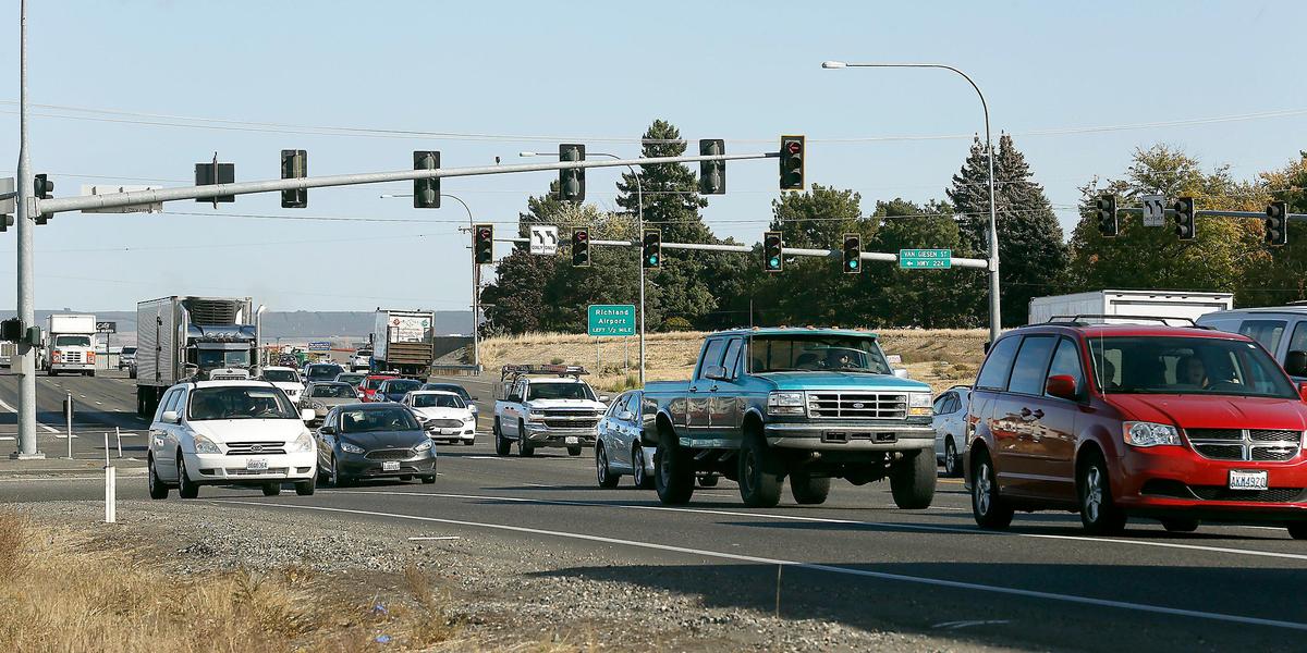 Traffic flows through the signal at the intersection of the Highway 240 bypass and Van Giesen Street in Richland.