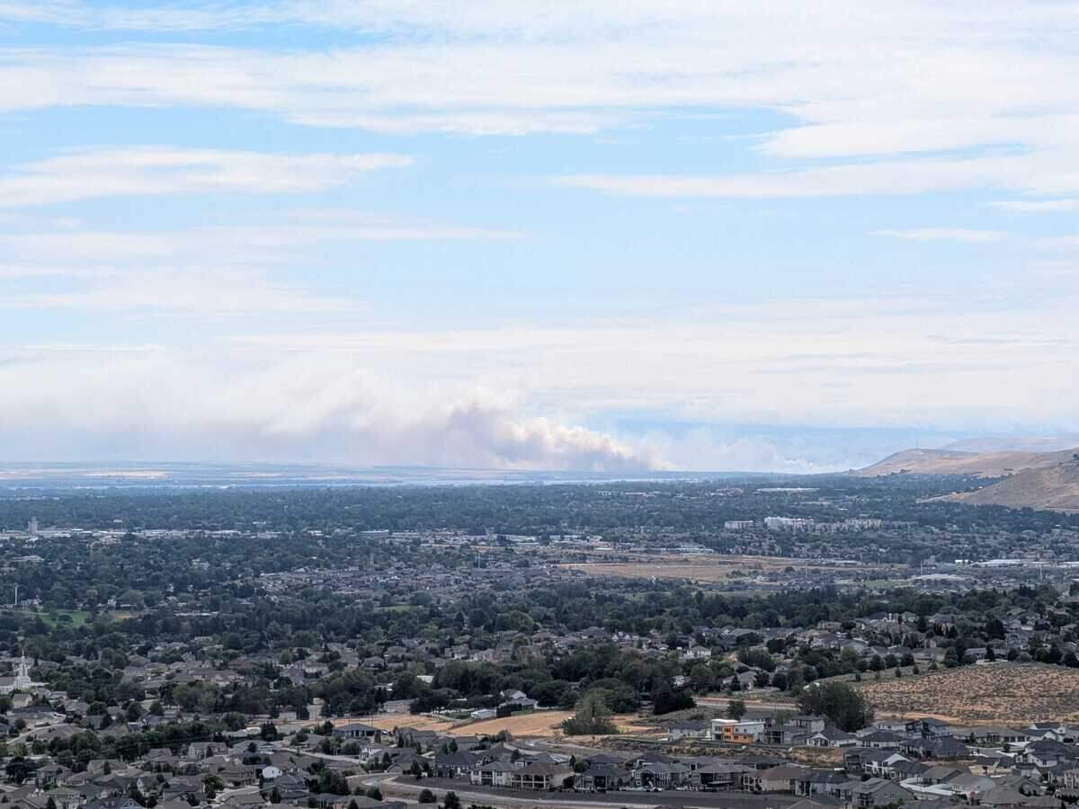 Smoke billows across the region from a wildfire that closed Highway 12 near Touchet on Monday.