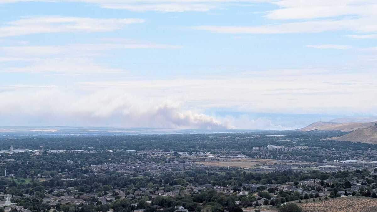 Smoke billows across the region from a wildfire that closed Highway 12 near Touchet on Monday.