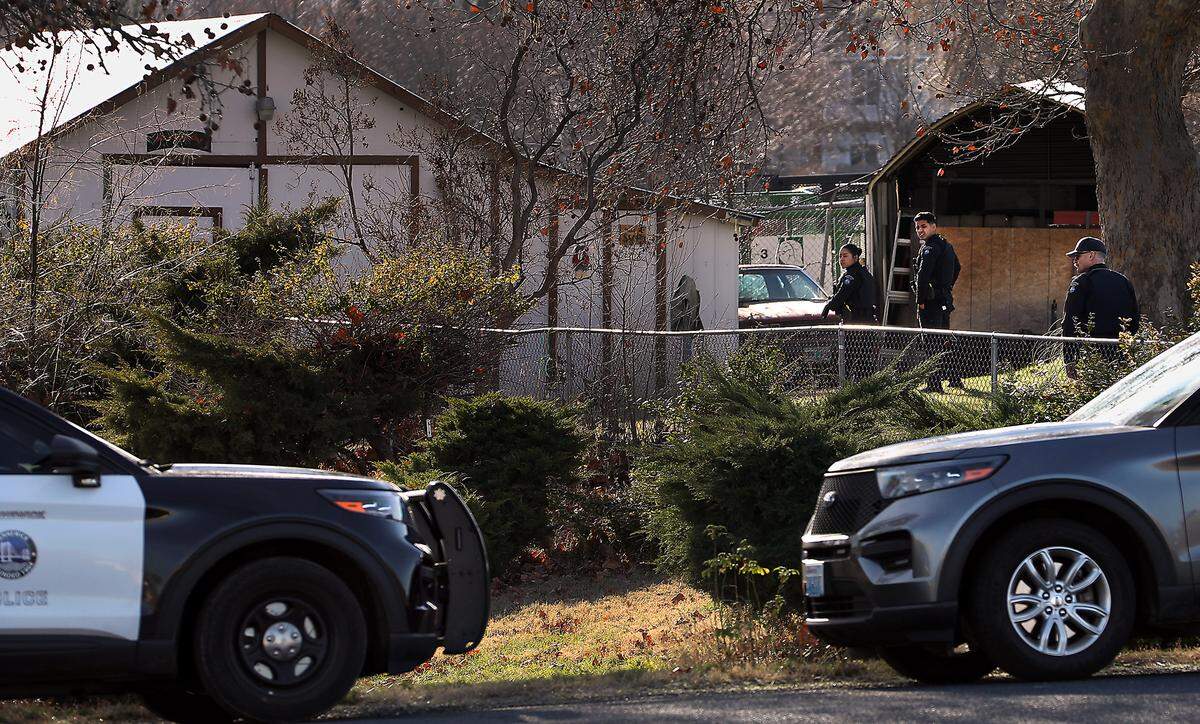 Kennewick police officers search the residential area on West 24th Avenue just west of South Ely Street Tuesday afternoon for a driver that failed to pull over for a traffic stop then ran away after crashing the car he was driving.