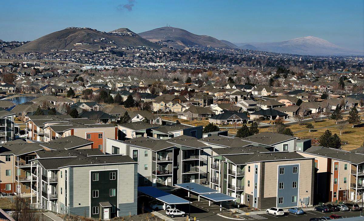 Apartments and housing development at Hansen Park in west Kennewick with Little Badger Mountain, Badger, Mountain, Candy Mountain and Rattlesnake Mountain in the background. Taken on Feb. 12, 2025.