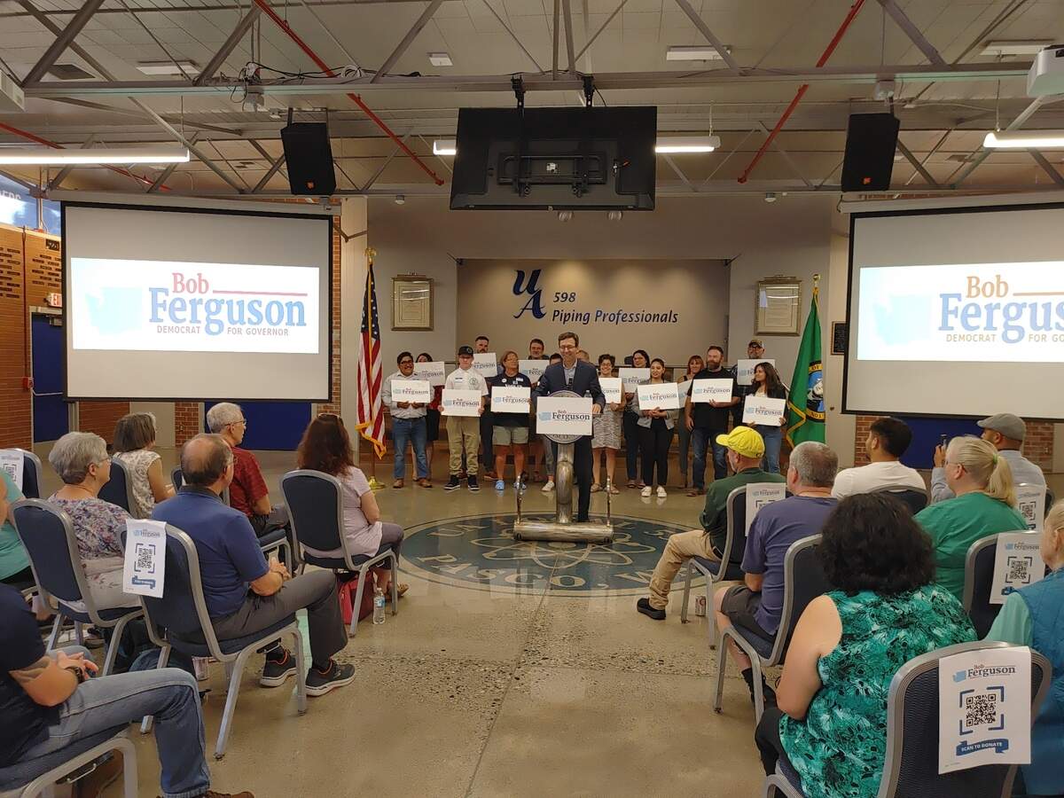 Washington Attorney General Bob Ferguson, flanked by supporters at Local 598 in Pasco, formally kicked off his campaign for governor Sept. 9 with a cross state tour that also included stops in Spokane and Seattle.