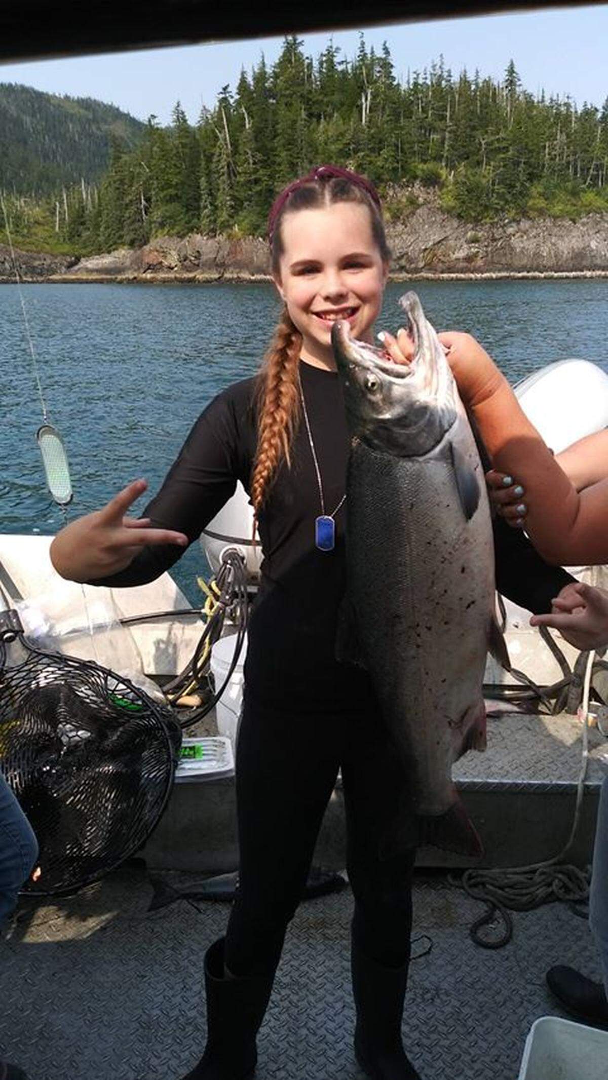 Maleah Chapin, 12, holds the silver salmon that took top prize in the Valdez, Alaska, Silver Salmon Derby.