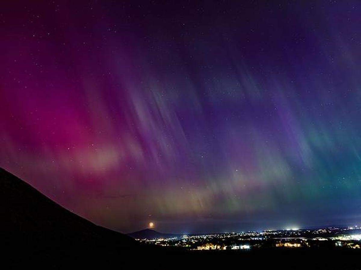Aurora picture taken from Badger Mountain on the evening of May 24, 2024, is highly visible even with the lights of the city