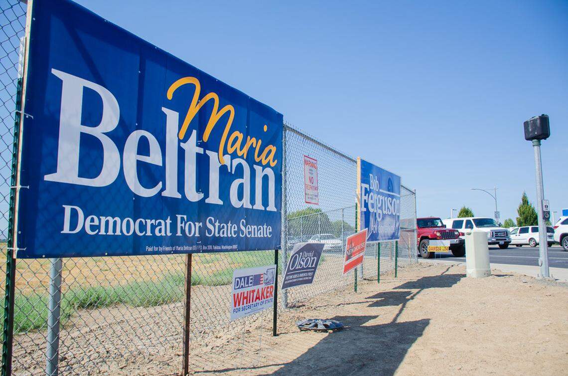 A flurry of campaign signs for candidates running in the Nov. 5 general election are posted at a Yakima, Wash., intersection.