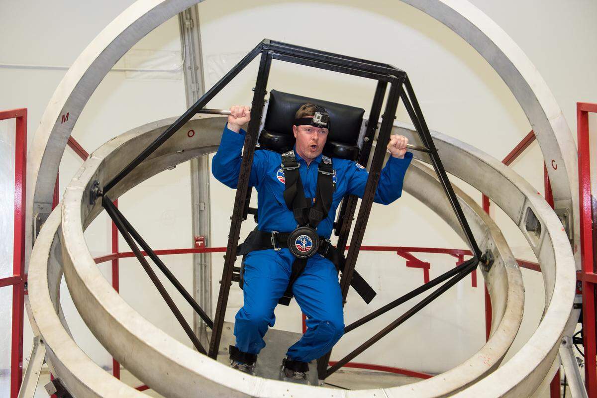 Richland teacher Trevor Macduff tries the multi-axis trainer at Honeywell Educators at Space Academy at the U.S. Space and Rocket Center in Huntsville, Ala. on June 21, 2018.