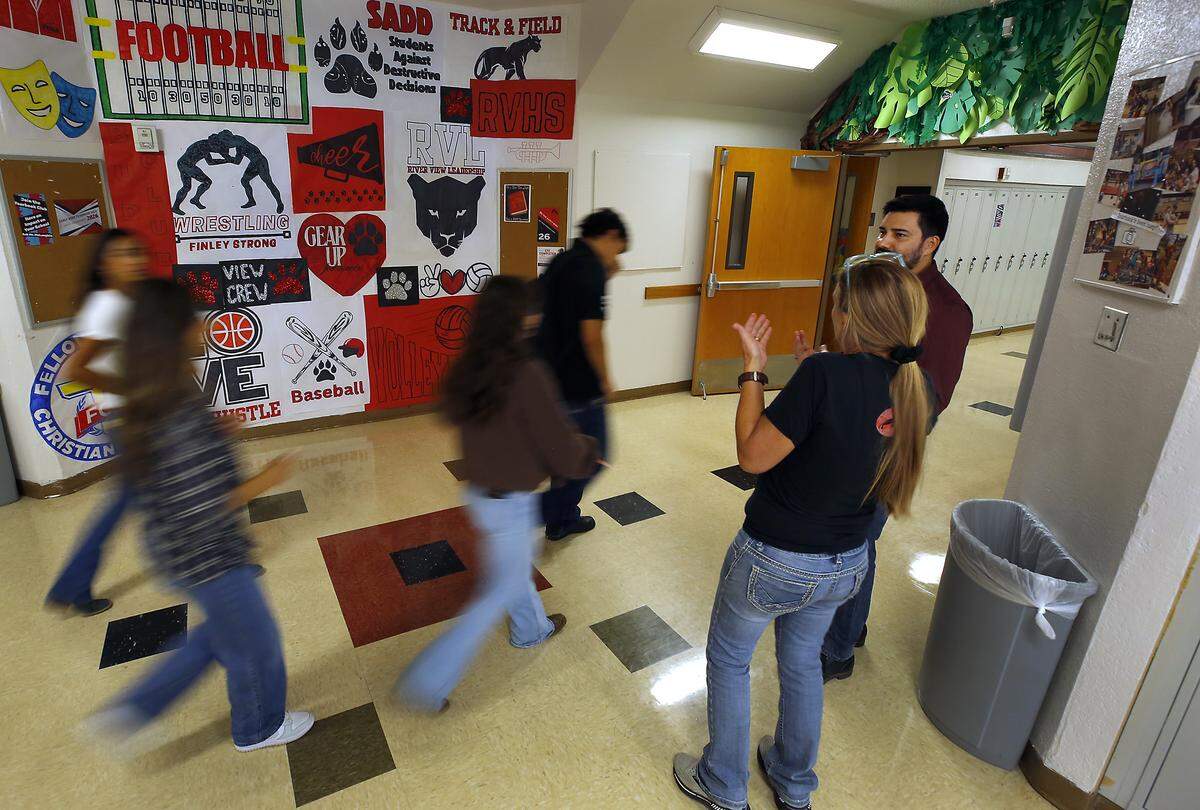 Students and staff walk in the hallways at RiverView High School in Finley after the bell rings for a class change. The school adopted a four day schedule and student now have an extra daily class period.
