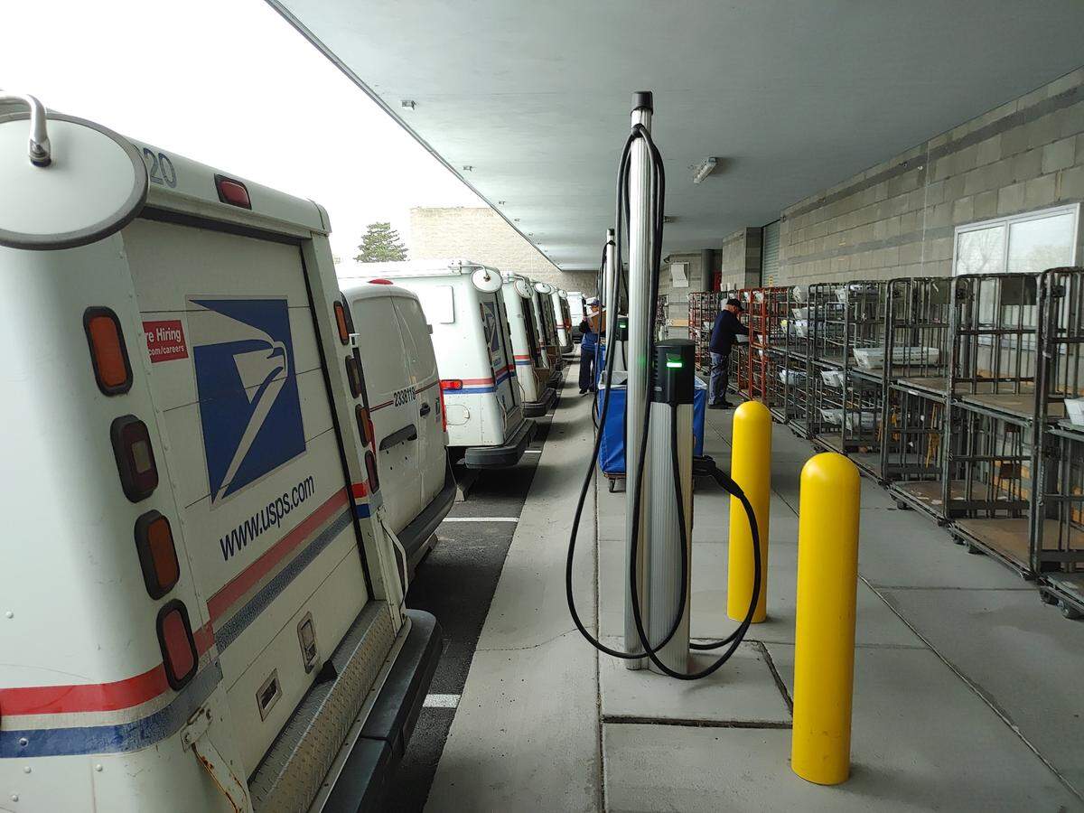 The U.S. Postal Service upgraded the parking at the Pasco mail center to accommodate more electric vehicles in the local fleet, which includes a mix of electric and gasoline delivery vehicles.