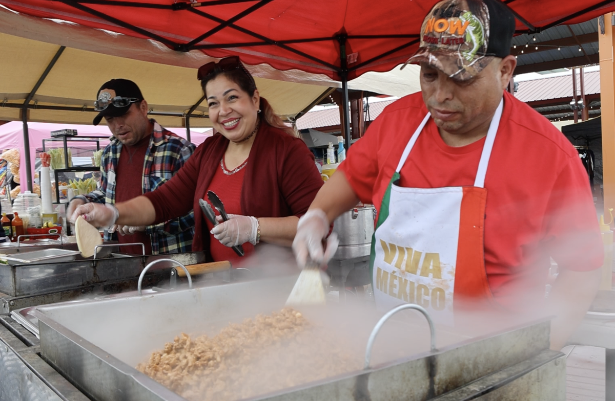 Staff at Tres Hermanos Tacos prepares meat filling and tortillas at Pasco’s Cinco de Mayo on Saturday, May 4.